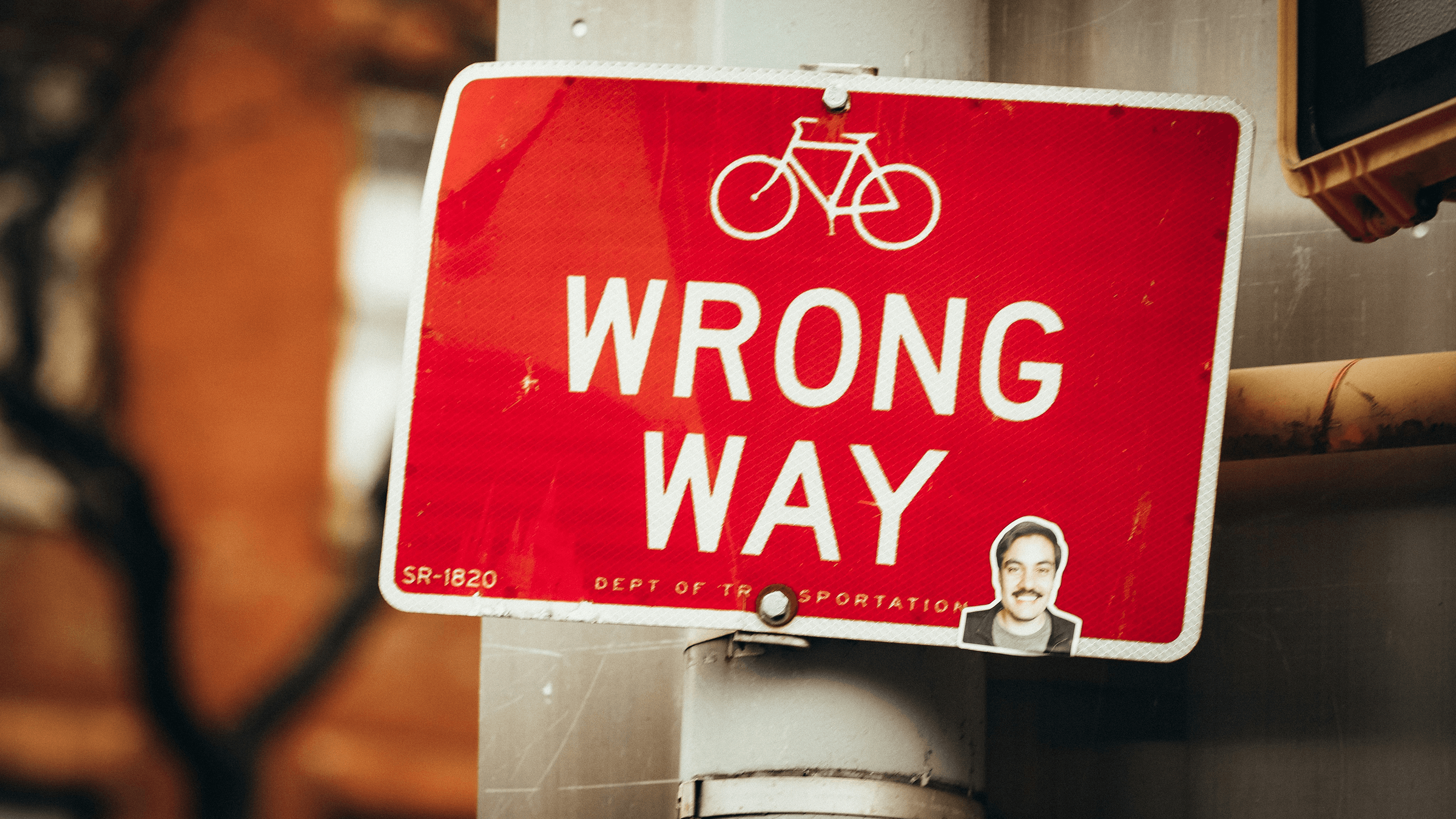 A red 'Wrong Way' road sign, a reminder for what happens when a team builds in the wrong direction